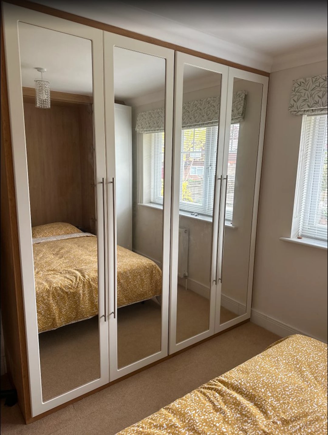 Bespoke fitted wardrobes with mirrored doors