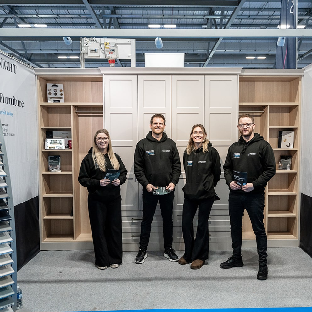 Our furniture design team in front of the DAY & KNIGHT display stand at Homebuilding & Renovation Show