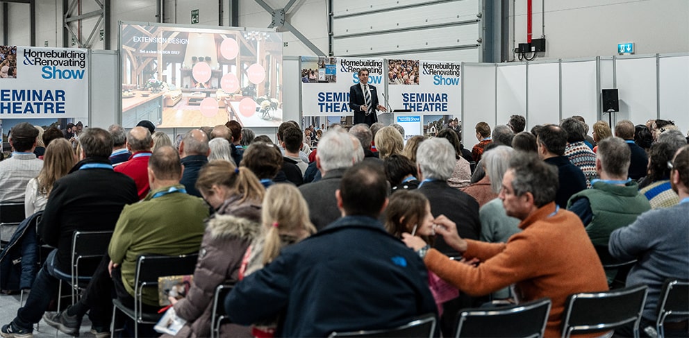 Live seminar being given to a seated crowed at the Homebuilding & Renovation Show in Farnborough, Hampshire