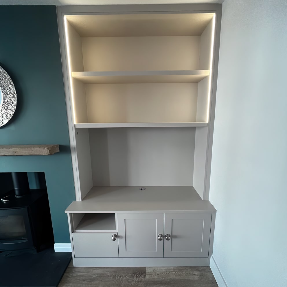 Built-in alcove bookcase with cupboards below