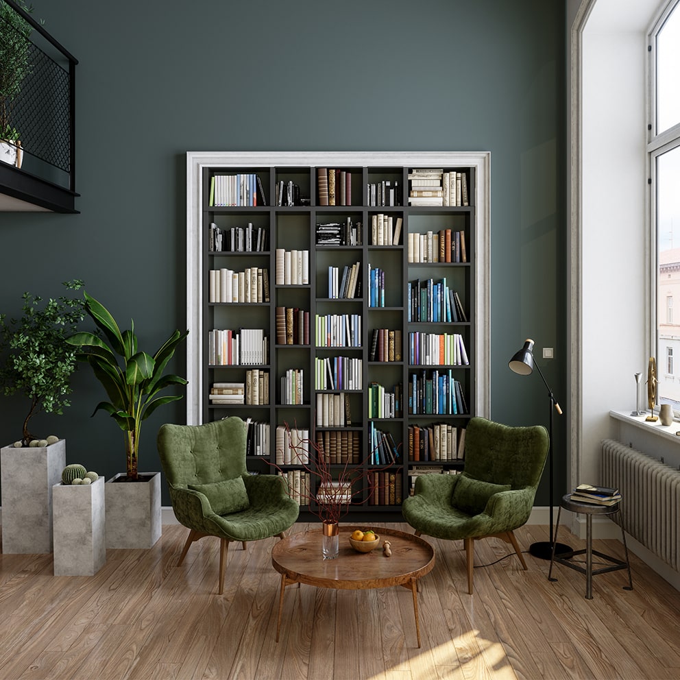 Built-in bookcase full of books in a luxury green room