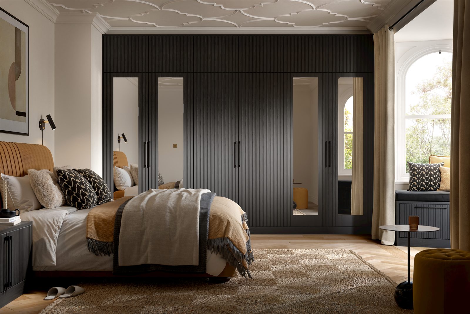 Dark fluted fitted wardrobes with full-length mirrored doors