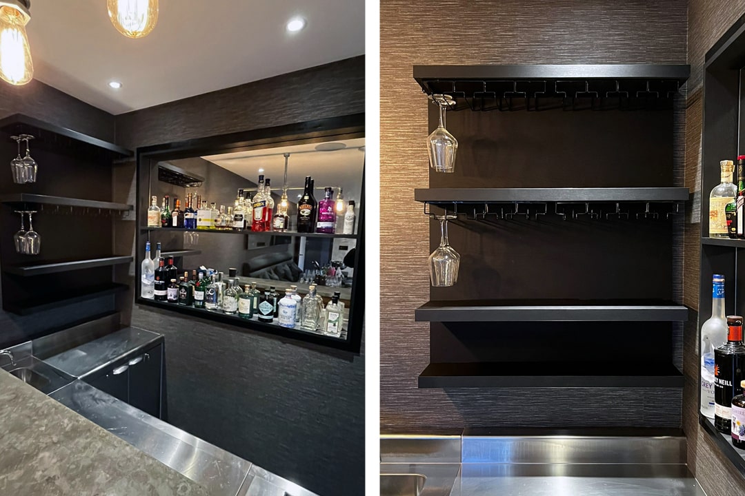 Dark home bar with spirit bottles and hanging glass racks