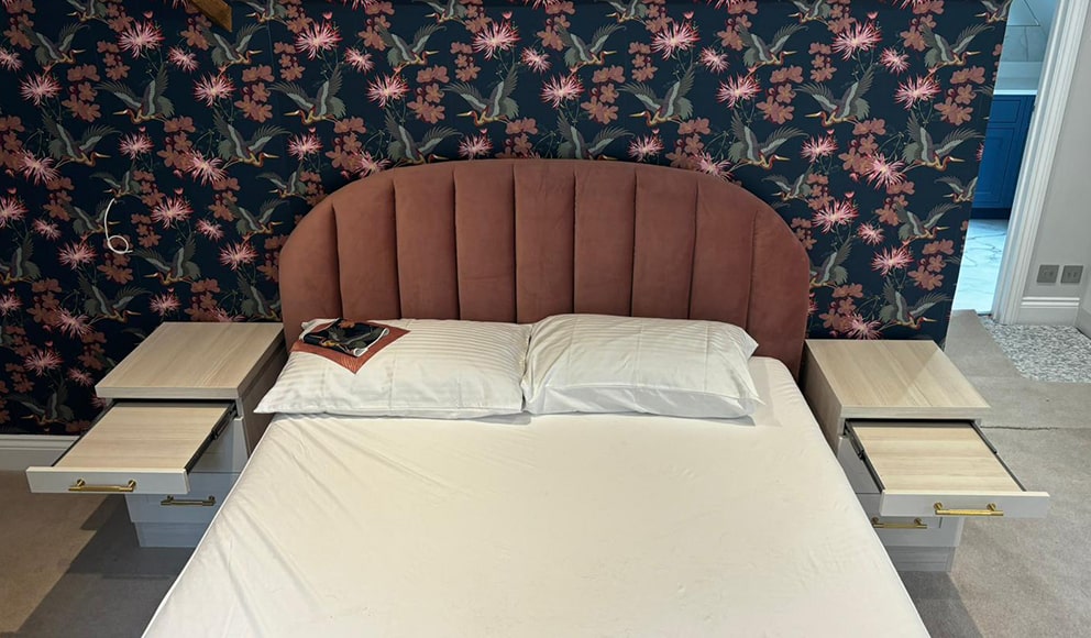 Pink velvet headboard with matching open bedside drawer units
