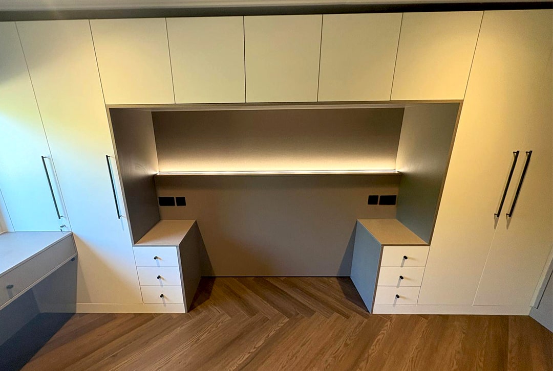 Cream overbed wardrobes with lit recess and side drawers